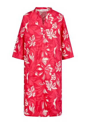 Red dress with short sleeves, featuring a floral pattern in white. The fabric is lightweight, with a relaxed fit and a v-neck design.