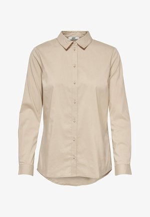 Beige pitkähihaispaita, jossa jämäkkä kaulus, napitettu etuosa ja kaarevat reunat. Sileä kangas, jossa on hienovarainen kiilto, ja napitetut kalvosimet.