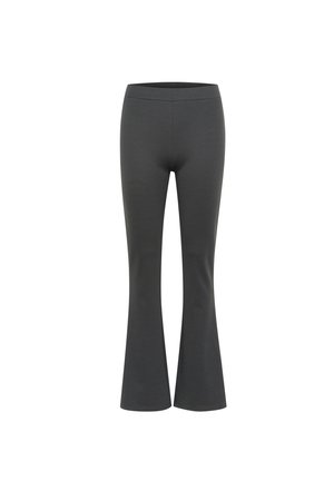 Pantalones acampanados negros elásticos con una textura suave y una cinturilla elástica. Ajustados en las caderas, se ensanchan a partir de las rodillas.