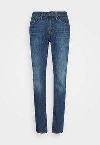 Mörkblå denimjeans med smal passform, med en medelhög midja, fem fickor och subtila slitningar på framsidan.
