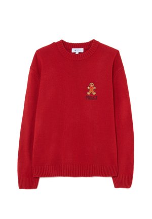 Maglione rosso a maglia con scollo tondo, maniche lunghe, polsini e orlo a coste. Presenta un ricamo a forma di omino di pan di zenzero sul petto.