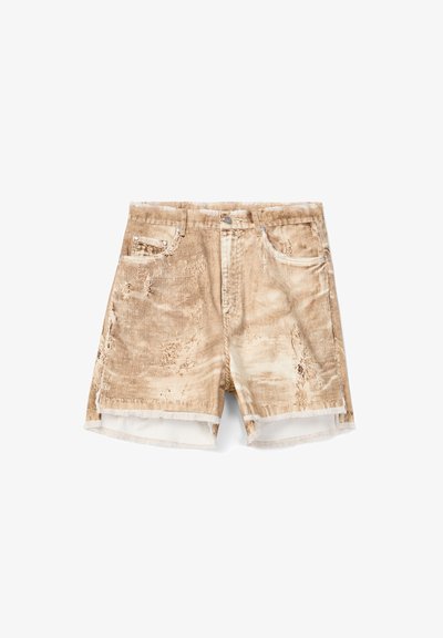 Beige corduroy shorts with distressed details, five-pocket design, frayed hems, and a front button closure on white background.