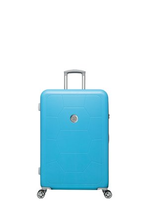 Hard-shell suitcase in bright blue, featuring a hexagonal pattern, silver logo, extendable handle, and four spinner wheels for mobility.