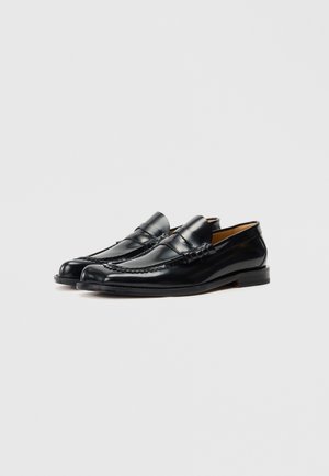 Rank 15: Vivienne Westwood - COIN - Slip-ons