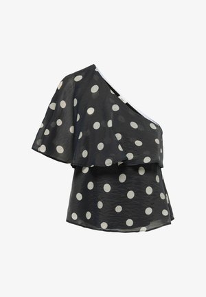 Sort enkelt skulder-bluse med hvide prikker og en lagdelt, flagrende ærme på venstre side.