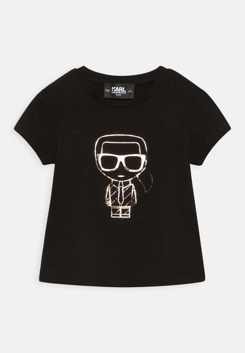 T-shirt nera in cotone con un personaggio brillante e in stile cartone animato, indossando un completo e occhiali da sole stampato sul davanti. Maniche corte e scollatura tonda.