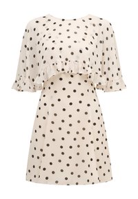 Cream dress with black polka dots, featuring a ruffled overlay on the chest and short, flowy sleeves with ruffle details.