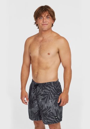 Bañador negro para hombres con un patrón de hojas, cintura elástica y cordón de ajuste. Hecho de tejido ligero. Ajuste estándar.