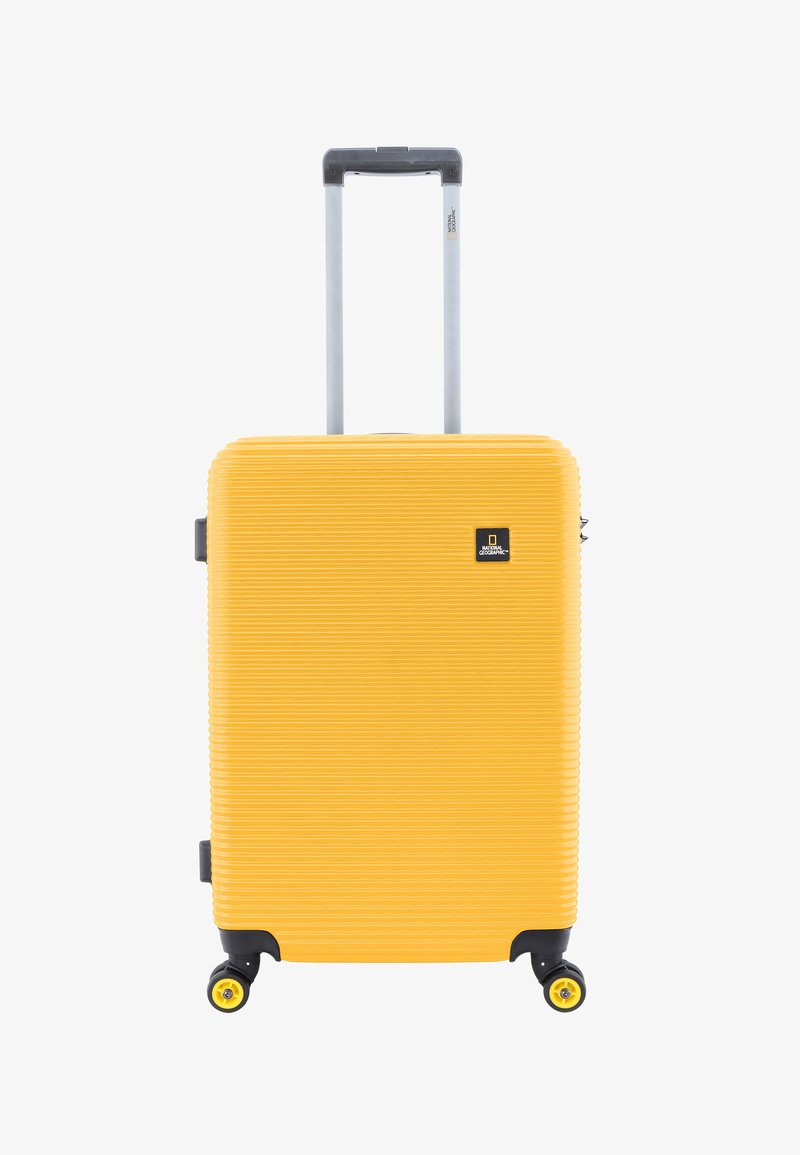 Hard-shell yellow suitcase with a ribbed design, retractable handle, and four black wheels. Features a logo on the front.