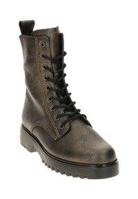 Bruine leren veterschoenen met een ronde neus, versterkte stiksels en een zwarte rubberen zool met een uitgesproken profiel.