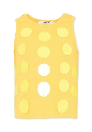 Żółty top bez rękawów z dużymi okrągłymi wycięciami ułożonymi w siatkę na przedzie.