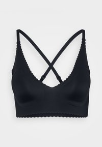 Black wireless bralette featuring a scalloped edge, smooth texture, adjustable crossed straps, and rounded cups for comfort.