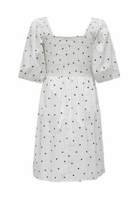 Robe blanche longueur genou avec manches bouffantes, encolure carrée, corsage froncé et motif de cœurs noirs sur toute la robe.