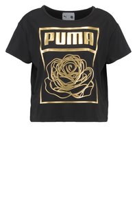 Camiseta negra cortada de algodón con un gran logo dorado de "PUMA" y un diseño floral en la parte frontal, con un cuello redondo y mangas cortas.