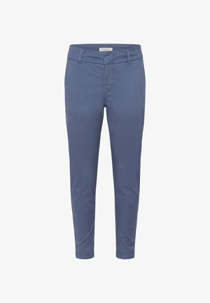 Sinised kitsenevad pahkluuni püksid vööaasade, eesmise tõmbluku ja küljetaskutega, valgel taustal.