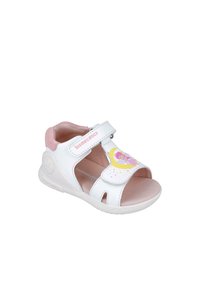 Sandali bianchi per bambini con accenti rosa, design aperto, cinturino regolabile e una grafica colorata di una fata sulla parte anteriore. Suola in gomma.