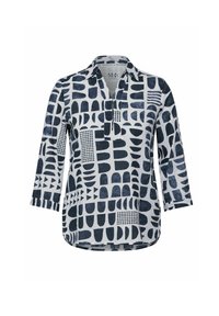 Chemise blanche avec motifs abstraits bleu foncé, dotée d'un col, d'une encolure en cranté et de manches trois-quarts. Fabriquée dans un tissu léger.