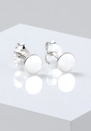 Silver stud earrings with circular white enamel inlays, smooth surface, and a reflective finish, mounted on a classic post design.