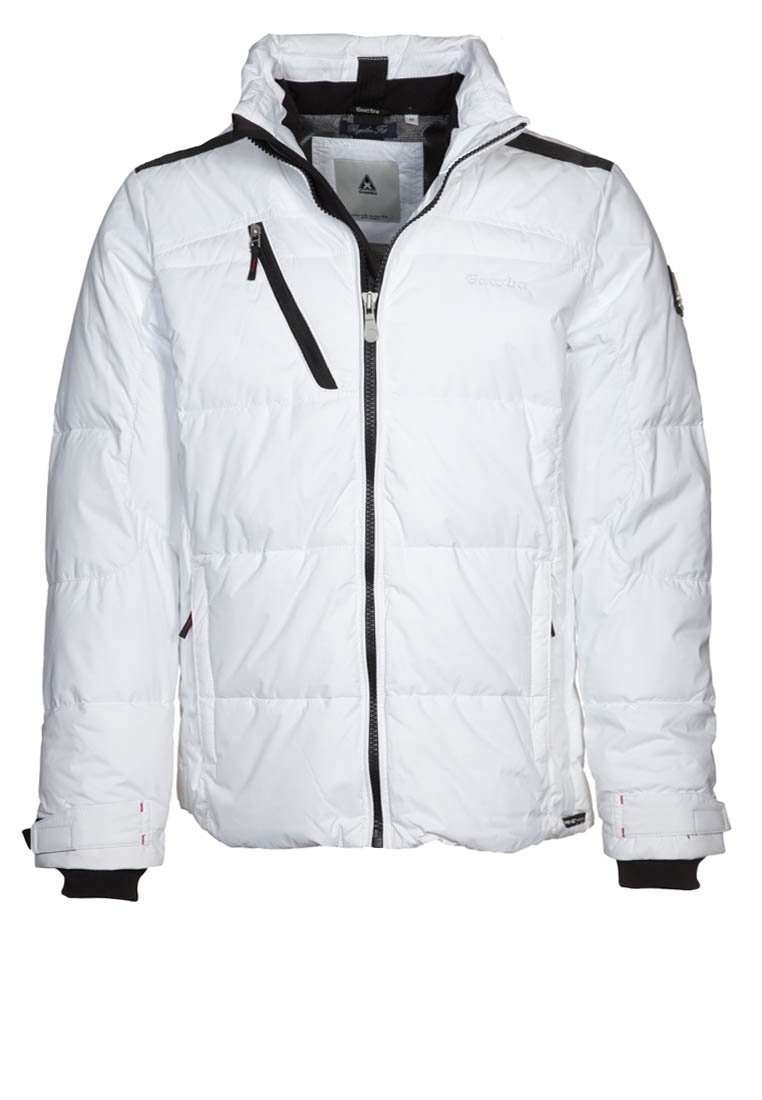 Vit pufferjacka med dragkedja fram, svarta accenter på axlarna och en bröstficka. Har texturerat tyg och stickade ärmslut.