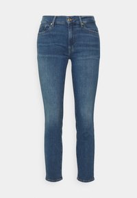 Dark blue denim jeans, slim fit, featuring a smooth texture, classic five-pocket design, zip fly, and a metal button closure at the waist.