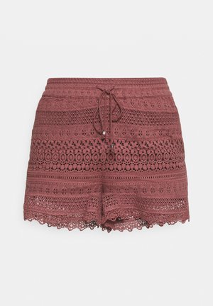 Pantalones cortos de ganchillo en color rosa empolvado con un patrón texturizado, cintura elástica, cinta de ajuste y detalles de dobladillo ondulado.