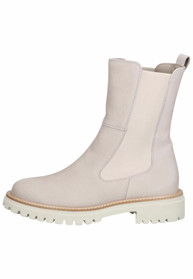 Bottine en cuir beige clair avec panneau latéral élastique, languette à l'arrière, semelle épaisse à crampons et coutures contrastantes autour de la semelle.