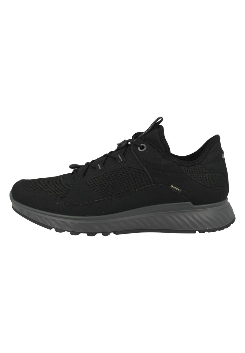 Scarpe da ginnastica nere con tomaia in tessuto testurizzato e suola in gomma a contrasto con battistrada sagomato per una buona aderenza. Design minimalista con lacci.
