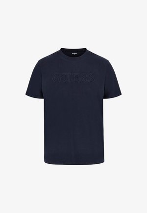 Marineblauwe katoenen t-shirt met korte mouwen met een verhoogd "GUESS" logo op de borst. Rond hals, relaxte pasvorm, gladde textuur.