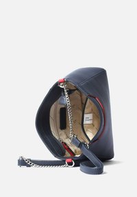 Navy leather handbag with a structured shape, silver chain strap, and red accents. Beige interior with printed pattern and zip pocket.