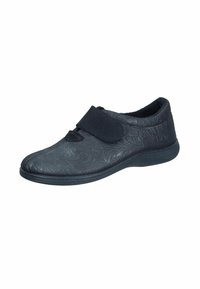 Black shoe made of patterned synthetic material, featuring a velcro strap, rounded toe, and a flexible rubber sole.