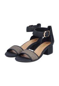 Schwarze Sandalen mit Blockabsatz, ausgestattet mit geflochtenen Akzenten an den Riemen. Verstellbarer Knöchelriemen mit einer goldenen Schnalle, geschlossene Rückseite.