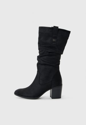 Black knee-high boots made of soft, smooth material with a slouched design, pointed toe, and a mid-height block heel.
