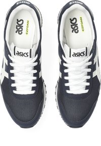 Navy blue athletic shoes with a mesh upper, white accents, and laces; features a padded collar and EZ foam cushioning insole.