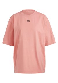 Pink cotton t-shirt with a round neck and short sleeves, featuring a black Adidas logo on the front. Boxy shape and smooth texture.