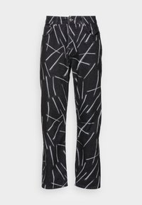 Jeans de mezclilla negra con un patrón abstracto blanco único. Presentan un corte recto, cinco bolsillos y un cierre estándar de botón y cremallera.