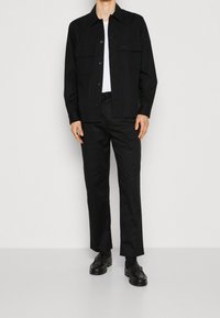 Calvin Klein Trousers - black