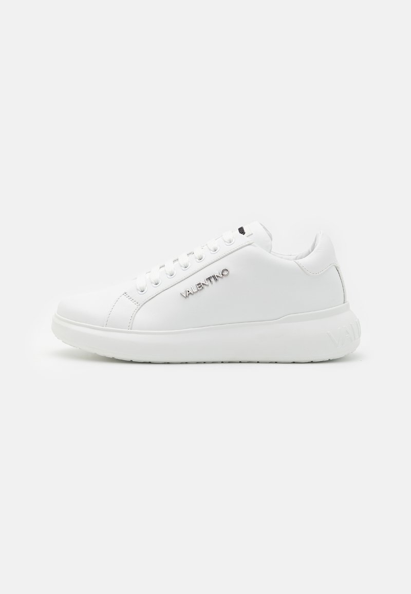 White leather sneaker with a smooth finish, featuring a padded collar, lace-up front, and 'VALENTINO' logo on the side. Thick rubber sole.