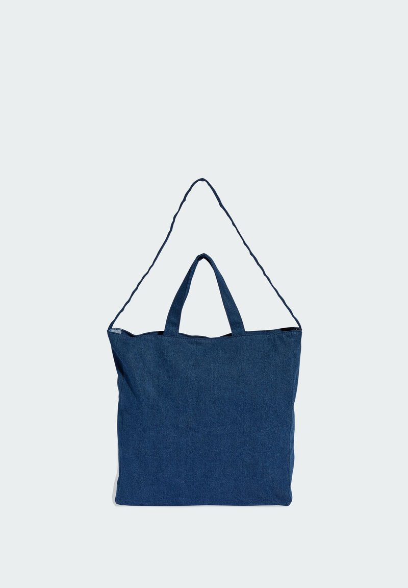 Denim tote bag in dark blue with a rectangular shape, double top handles, and a single detachable strap. Smooth texture, minimal design.