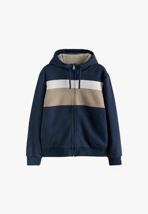 Námořnický zipový mikina s měkkým, krémovým a bílým horizontálním pruhovaným vzorem. Obsahuje útulný fleeceový interiér a kapuci na šňůrku.