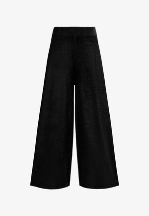Čierne široké nohavice z plyšového materiálu, s vysokým elastickým pásom bez viditeľných ozdôb alebo vzorov.