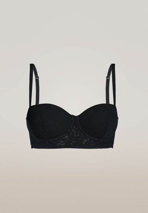Reggiseno con ferretto in pizzo nero, dotato di coppe sagomate, spalline regolabili e finitura testurizzata. Caratterizzato da un colore nero uniforme e design senza cuciture.