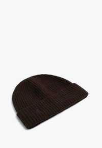 Brown ribbed knit beanie with a folded cuff and subtle logo detail, made from soft, textured material, suitable for cooler weather.