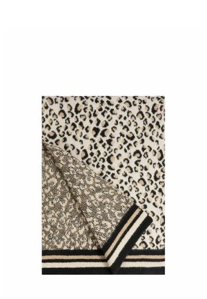 Tessuto lavorato a maglia con motivo leopardato e strisce a contrasto nere e crema nella parte inferiore. La texture appare morbida e calda.