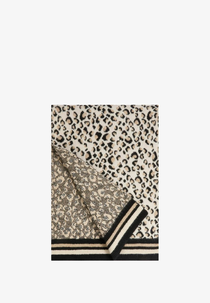 Tessuto lavorato a maglia con motivo leopardato e strisce a contrasto nere e crema nella parte inferiore. La texture appare morbida e calda.