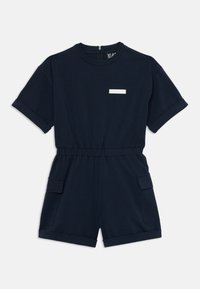 Σκούρο μπλε βαμβακερή φόρμα με κοντά μανίκια, ελαστική μέση, δύο πλαϊνές τσέπες και μια μικρή λευκή ετικέτα στο στήθος.