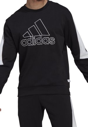 Sweat-shirt noir avec panneaux latéraux blancs et logo "adidas" brodé. Comprend un col rond, des manches longues et une coupe décontractée.
