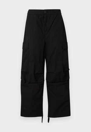 Black cargo pants with elastic waistband, button closure, side flap pockets, and wide straight legs with adjustable hems.