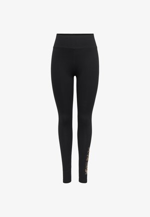 Black leggings with a high waistband, made of smooth, stretchy fabric, featuring a decorative gold and white pattern on the lower left leg.
