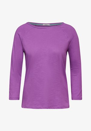 Fialový top s dlouhým rukávem a kulatým výstřihem. Má lehkou, hladkou texturu a raglánové rukávy pro pohodlný střih.