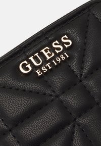 Guess ASSIA SMALL ZIP AROUND - Portemonnee - black